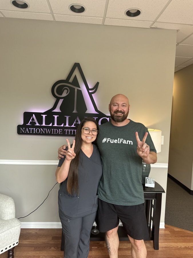 Seller with KC Home Offers and the title company at closing