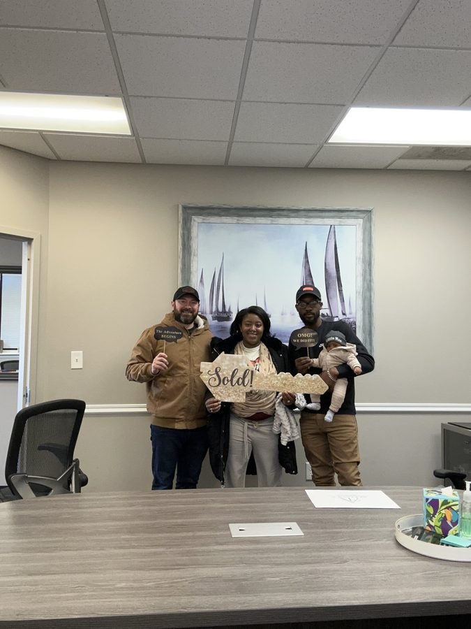 Homeowners with checks after a cash home sale