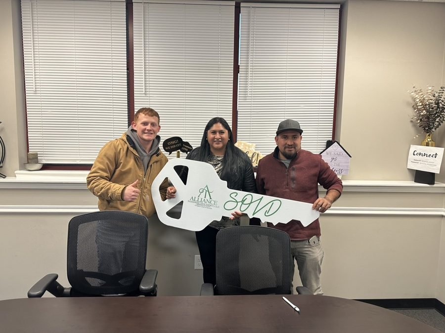 Seller shaking hands at a Kansas City closing